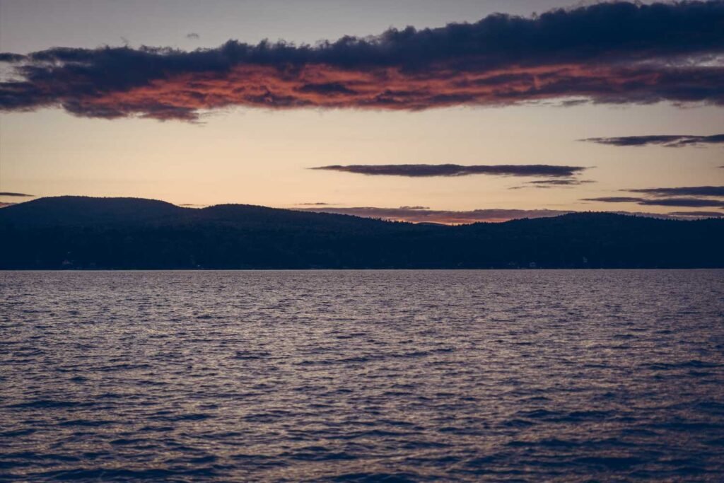 Lóma on the Lake sunset clouds Schroon Lake New York